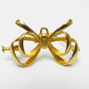Broche de solapa en forma de lazo en Oro de 18k. Peso: 4,30 gr.