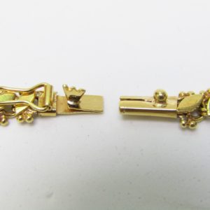 Collar articulado en Oro Amarillo, doble cara. Peso 27,5 gr.