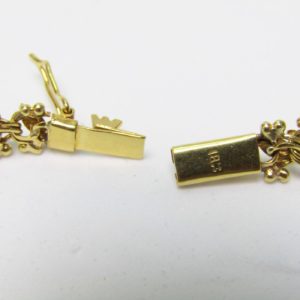Collar articulado en Oro Amarillo, doble cara. Peso 27,5 gr.