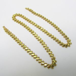 Collar articulado en Oro Amarillo, doble cara. Peso 27,5 gr.