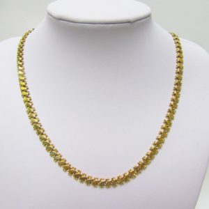 Collar articulado en Oro Amarillo, doble cara. Peso 27,5 gr.