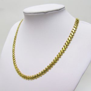 Collar articulado en Oro Amarillo, doble cara. Peso 27,5 gr.