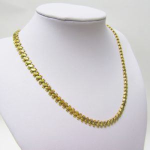 Collar articulado en Oro Amarillo, doble cara. Peso 27,5 gr.