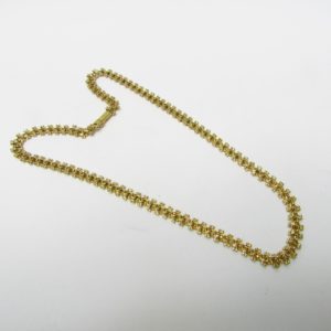 Collar articulado en Oro Amarillo, doble cara. Peso 27,5 gr.
