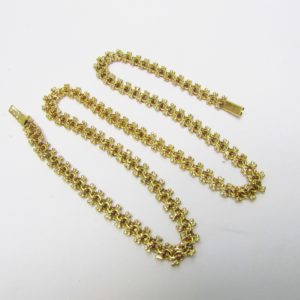 Collar articulado en Oro Amarillo, doble cara. Peso 27,5 gr.
