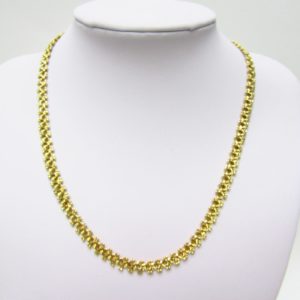 Collar articulado en Oro Amarillo, doble cara. Peso 27,5 gr.