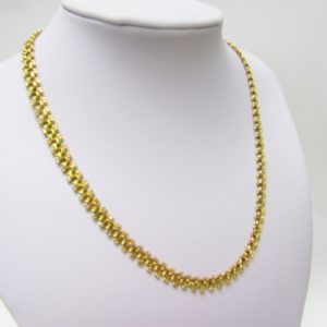 Collar articulado en Oro Amarillo, doble cara. Peso 27,5 gr.