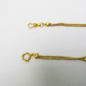 Leontina Antigua, Siglo XIX. Terminal-Cadena para reloj de Bolsillo. Oro 18k. Peso: 16,91 gr.
