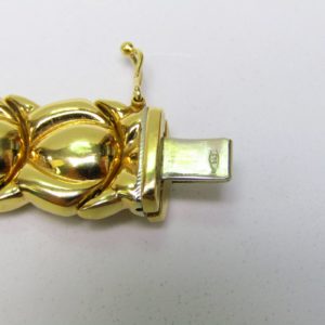 Pulsera articulada y reversible en Oro Bicolor de 18k. 30,80 gr.