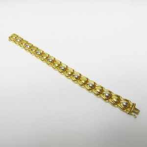 Pulsera articulada y reversible en Oro Bicolor de 18k. 30,80 gr.