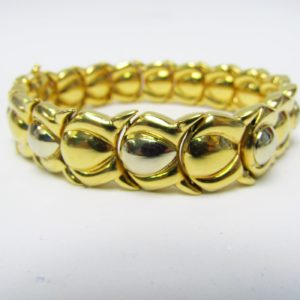 Pulsera articulada y reversible en Oro Bicolor de 18k. 30,80 gr.