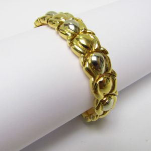 Pulsera articulada y reversible en Oro Bicolor de 18k. 30,80 gr.