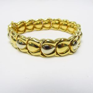 Pulsera articulada y reversible en Oro Bicolor de 18k. 30,80 gr.