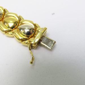 Pulsera articulada y reversible en Oro Bicolor de 18k. 30,80 gr.