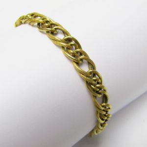 Pulsera en Oro de 18k con eslabones barbados lisos y matizados. 7,25 gr.