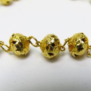 Collar en Oro Amarillo de 18k con eslabones esféricos calados y repujados. Peso 16,30 gr.