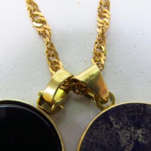 Collar sogueado con dos colgantes, "Sol y Luna", en Oro de 18k. 12,45 gr.