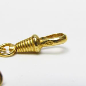 Leontina antigua. Terminal cadena para reloj de bolsillo. Oro 12-14k. Peso: 17,70 gr.