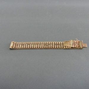 Pulsera ancha en Oro de 18k con flecos. 58 gr.