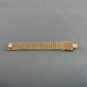 Pulsera ancha en Oro de 18k con flecos. 58 gr.