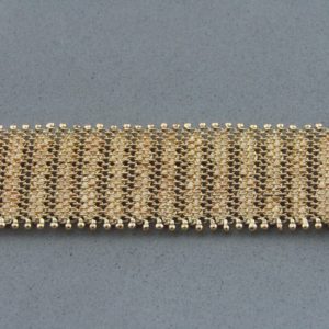 Pulsera ancha en Oro de 18k con flecos. 58 gr.