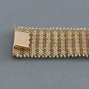 Pulsera ancha en Oro de 18k con flecos. 58 gr.