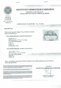 Sortija en Oro Blanco de 18k. con Diamante Natural Central, talla Antigua Europea de 0,61 ct. (H/P1) y dos de 0,36 ct. (H/S1). Certificado IGE.