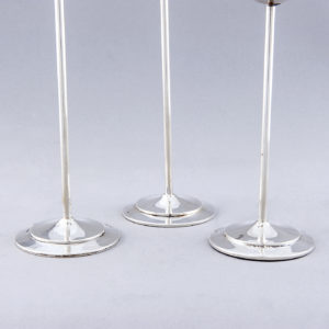 Conjunto de tres candeleros en Plata de Ley, España, siglo XX.
