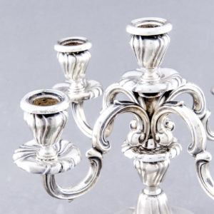 Pareja de candelabros de cinco luces en Plata de Ley. MATILDE ESPUÑES. España. Siglo XX.