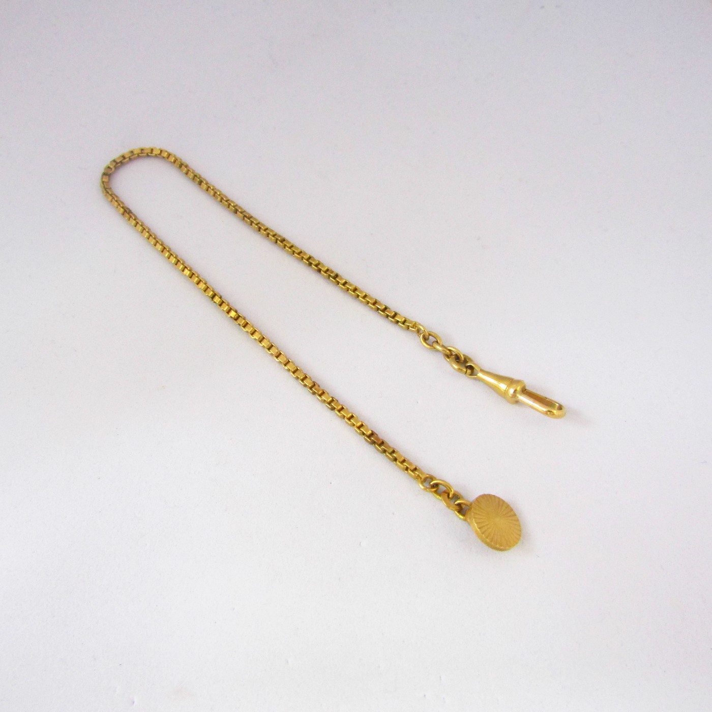 Leontina antigua. Terminal cadena para reloj de bolsillo. Oro 18k. 10,78 gr. Leontina antigua. Terminal cadena para reloj de bolsillo. Oro 18k. 10,78 gr.