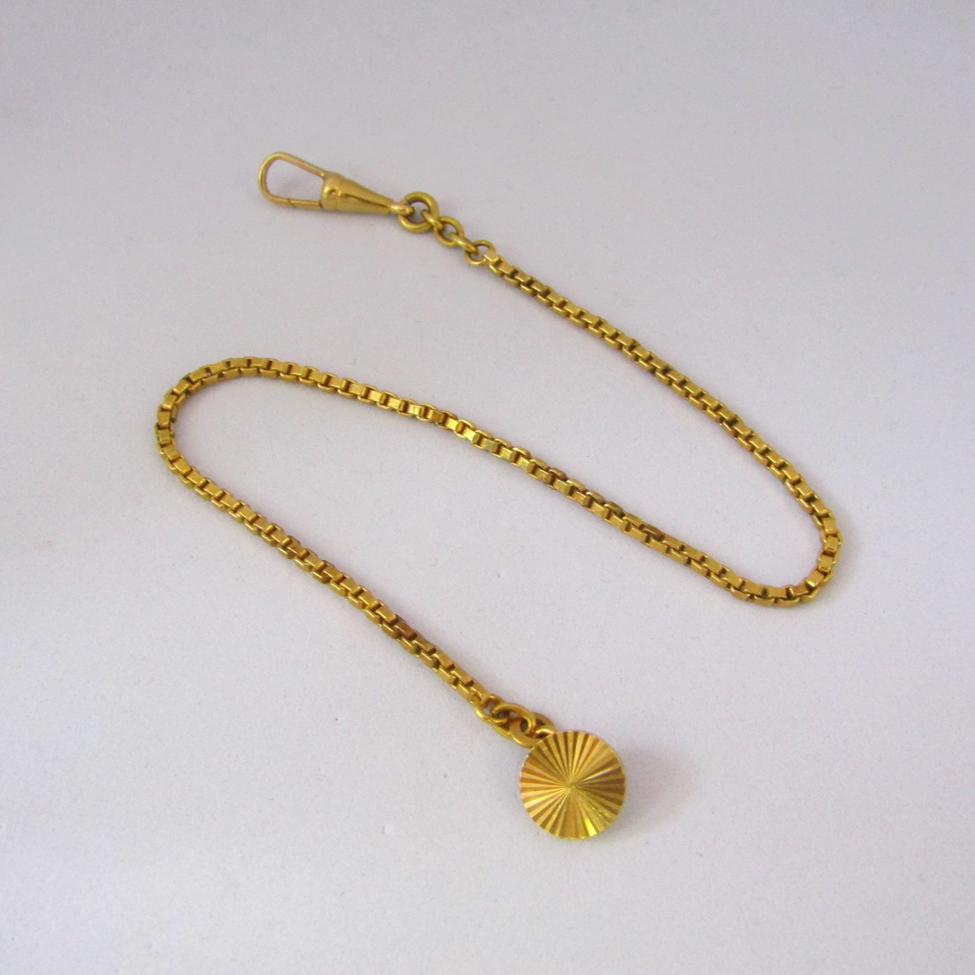Leontina antigua. Terminal cadena para reloj de bolsillo. Oro 18k. 10,78 gr. Leontina antigua. Terminal cadena para reloj de bolsillo. Oro 18k. 10,78 gr.