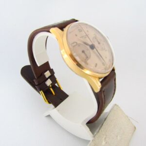 BAUME AND MERCIER (GENEVE). Reloj Cronógrafo de pulsera para caballero. Oro 18k. Suiza, ca. 1950
