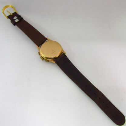 BAUME AND MERCIER (GENEVE). Reloj Cronógrafo de pulsera para caballero. Oro 18k. Suiza, ca. 1950