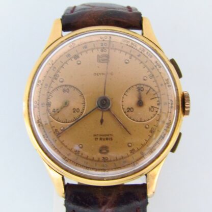 OLYMPISCH. Chronograph Armbanduhr für Männer. 18 Karat Gold. Schweiz, ca. 1950.