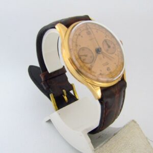 OLYMPIC. Reloj Cronógrafo de pulsera para caballero. Oro 18k. Suiza, ca. 1950.