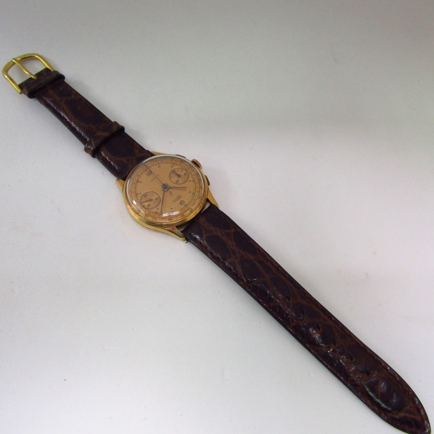 OLYMPIC. Reloj Cronógrafo de pulsera para caballero. Oro 18k. Suiza, ca. 1950. OLYMPIC. Reloj Cronógrafo de pulsera para caballero. Oro 18k. Suiza, ca. 1950.