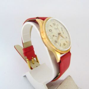 Reloj Cronógrafo de pulsera para caballero. Marca CORANIC. Oro 18k. Suiza, Ca. 1950