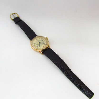 Reloj Cronógrafo de pulsera para caballero. Oro 18k. Suiza, ca. 1950