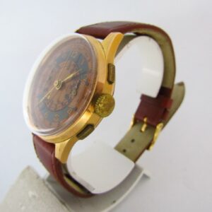 Reloj Cronógrafo de pulsera para caballero. Oro 18k. Suiza, ca. 1955.