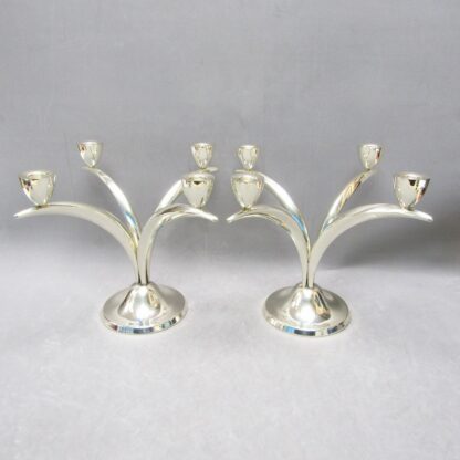 Pair of sterling silver candelabra with four lights. Spain, 20th century.