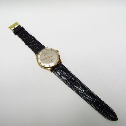 OMÉGA. Montre-bracelet pour homme. Or 18 carats. Suisse, 1952.
