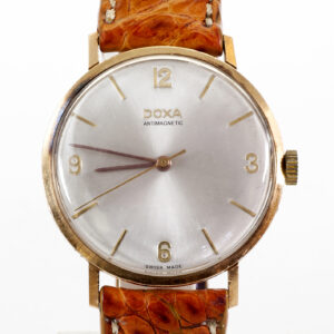 DOXA. Reloj de pulsera para caballero. Oro 14k. Suiza, ca.1950