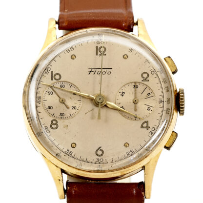 FLUDO. Reloj Cronógrafo de pusera para caballero. Fabricación suiza. Fecha ca. 1950. Oro 18k.