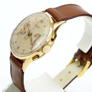 FLUDO. Reloj Cronógrafo de pusera para caballero. Fabricación suiza. Fecha ca. 1950. Oro 18k.