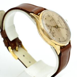 FLUDO. Reloj Cronógrafo de pusera para caballero. Fabricación suiza. Fecha ca. 1950. Oro 18k.