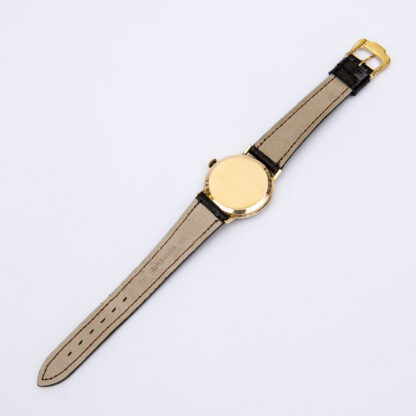 moved. Men's wristwatch. 18k gold case. ca. 1960.