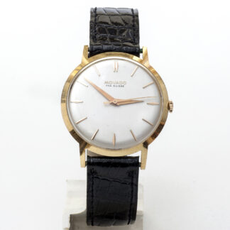 Movado. Reloj de pulsera para caballero. Oro 18k. Ca. 1960.