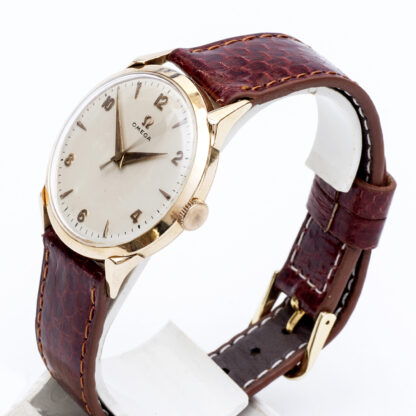 OMEGA. Herrenarmbanduhr. 18k Goldgehäuse. Armband in GoldFilled. Schweiz, 1952.