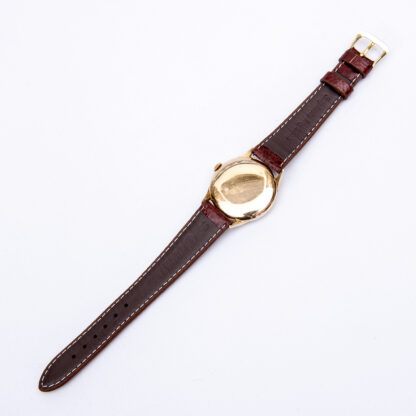 OMEGA. Herrenarmbanduhr. 18k Goldgehäuse. Armband in GoldFilled. Schweiz, 1952.
