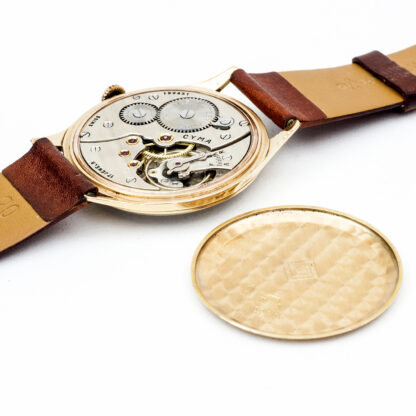 CYMA modelo CYMAFLEX. Reloj de pulsera para caballero. Oro 18k. Suiza, ca. 1940.